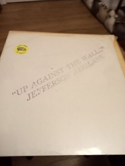 A LP BY JEFFERSON AIRPLANE IN ORANGE VINYL WITH LYRICS ON THE COVER