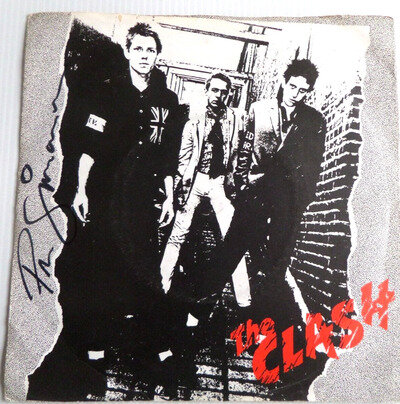 PAUL SIMONON THE CLASH, AUTOGRAPHED 7 INCH VINYL RECORD.