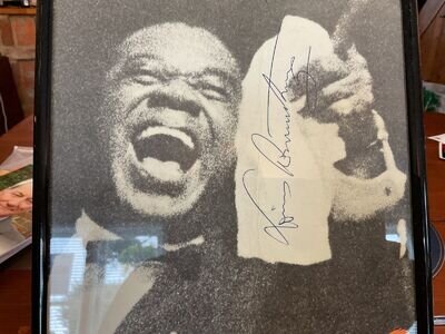 Louis Armstrong autograph. Signed on a 1965 concert programme; includes ticket.